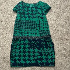 Green and blue houndstooth dress with studs at waist, pockets and zip closure